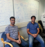 With Vijay at the computer vision lab, Cambridge, 2015. The whiteboard behind shows a recent work on understanding symmetries in deep learning.